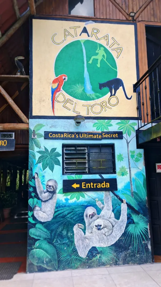 The painted entrance to Catarata del Toro in Bajos del Toro