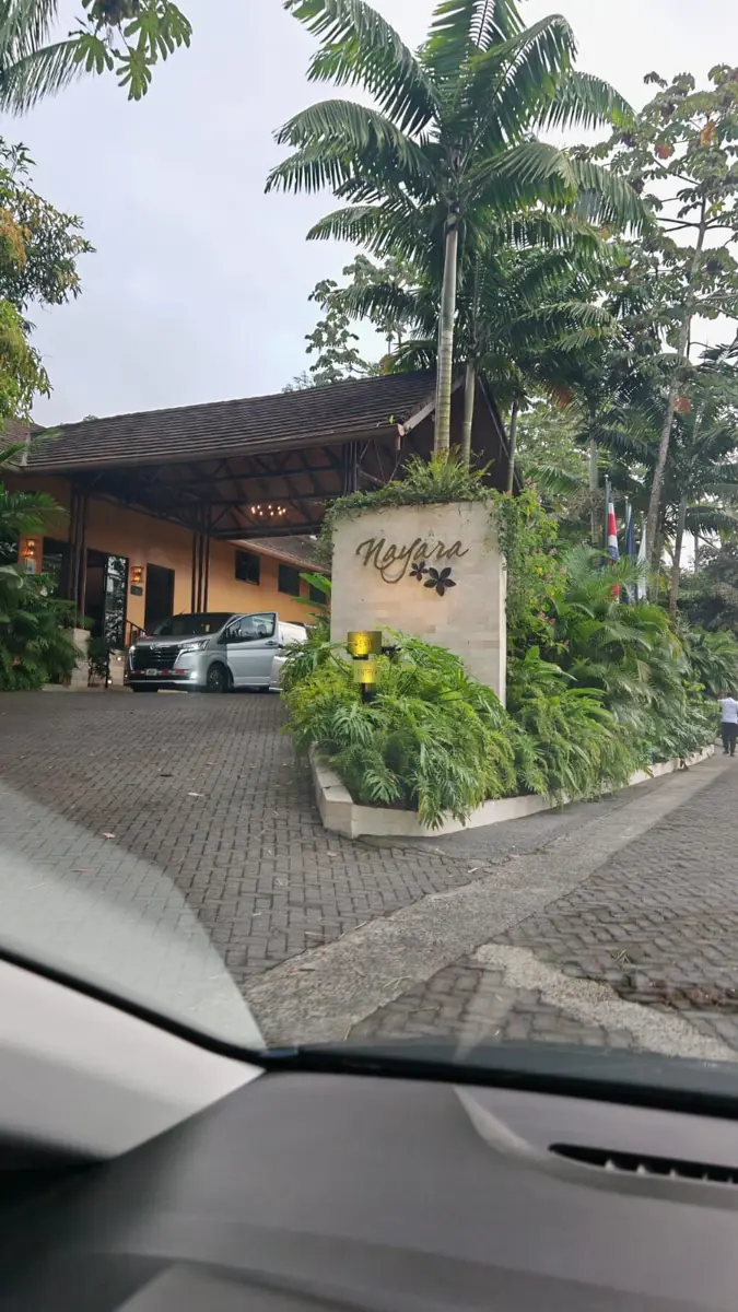 Driving into Nayara, at the entrance sign in Arenal