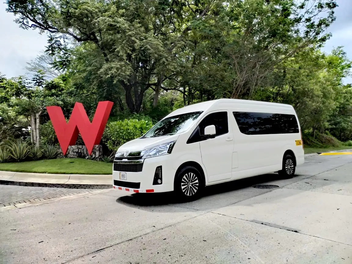 A Tropical Experts Toyota Hiace beside the red W of W Costa Rica – Reserva Conchal