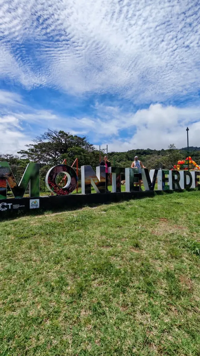 The MONTEVERDE letters on a grassy hill