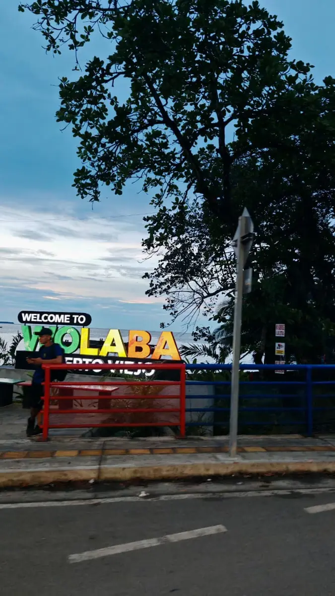 Colourful welcome sign by the sea in Puerto Viejo